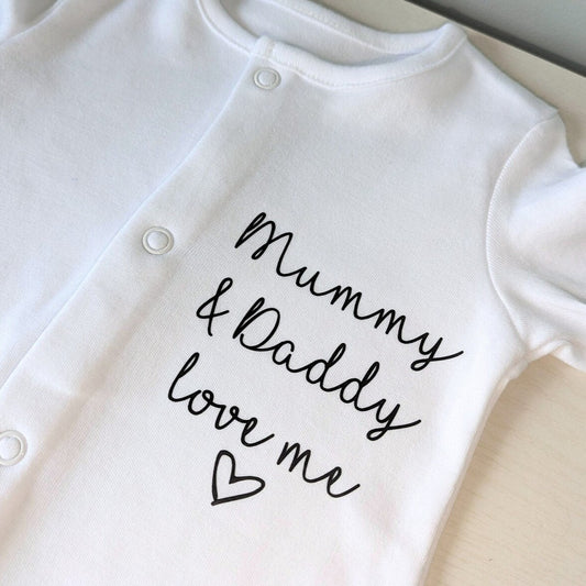 Sleepsuit with message and love heart.