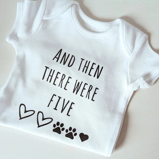 Baby body suit with "And then there were five".
